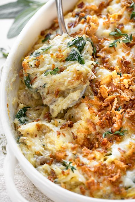 Brimming with fall flavors, this spaghetti squash casserole is prepared with a creamy Gruyere sauce and topped with crispy fried onions! | thecozyapron.com #spaghettisquashcasserole #spaghettisquashcasserolerecipes #spaghettisquashcasserolehealthy Thanksgiving Spaghetti Squash Recipes, Fall Squash Casserole, Spaghetti Squash Thanksgiving, Thanksgiving Spaghetti Squash, Spaghetti Squash Carbonara Recipes, French Onion Spaghetti Squash, Veggie Casserole Recipes Thanksgiving, Healthy Fall Casserole Recipes, Unique Casserole Recipes