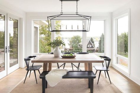 Darlena Linear Lantern boasts in a dining room above a light brow chunky wood dining table and a set of black wishbone chairs. Dinign Room, Beach House Room, Bria Hammel, Beach Home Interiors, Neutral Dining Room, Black Bench, Beach House Interior, Beach House Design, House Room