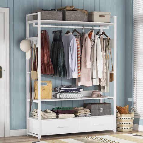 Sturdy and spacious, the heavy-duty metal frame and thick particle board of this closet organizer ensure stability and a weight capacity of 400 lb. With ample storage including 2 shelves, double drawers, and a wide hanger rod, it's perfect for cramped closets. The chic design and easy assembly make it suitable for any room. Versatile and compact, it fits well in laundry rooms, bedrooms, or walk-in closets. Enjoy peace of mind with included labeling, tools, and 18 months of quality assurance. Freestanding Closet, Closet Organizers & Garment Racks, Shelves Closet, Organiser Son Dressing, Standing Closet, Closet Storage Systems, Rack Shelves, Armoire Dresser, Free Standing Closet