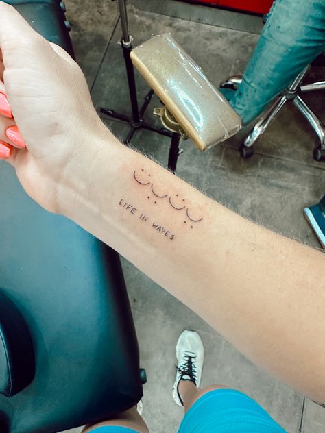 #tattoo #inspirational #wrist #waves #minimalisttattoo #vibeytattoo #vibes Waves Of Life Tattoo, Wave Quote Tattoo, Happiness Comes In Waves Tattoo, Waves Tattoo With Words, Wave Writing Tattoo, Wave Meaning Tattoo, Small Wave Tattoo, Waves Tattoo, Minimalist Tattoo