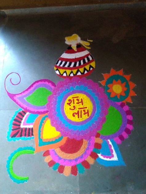 the rangoli is a piece of design with 'shubh labh' written in middle. The Middle, Design