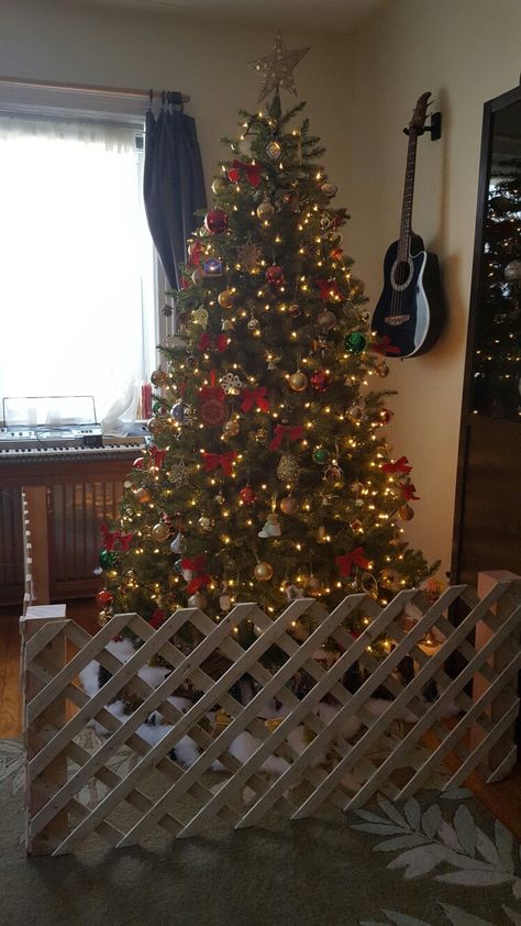 Baby proof christmas tree Baby Proof Christmas Tree Fence, Christmas Tree Gate Fence, Toddler Christmas Tree Proof, Kid Proof Christmas Tree, Puppy Proof Christmas Tree Ideas, Baby Proofing Christmas Tree, Christmas Tree Fence Pets, Diy Christmas Tree Fence, Gate Around Christmas Tree