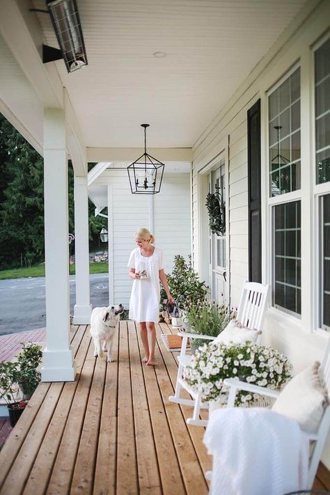 A favourite spot at our home is the front porch. It’s a beautiful place to sit in the morning and listen to the birds sing. In the evening,  the sun sets just right above and below the trees,  so Steve and I love to unwind from the day and watch the kids play up and down our long driveway. When… Country Style Outdoor Area, Cottage Home Front Porch, Back Porch Inspiration Outdoor Living, Front Porch Ideas Large, Small Wood Front Porch Ideas, Long Verandah Ideas, Front Porch Bench Styling, Styling A Long Front Porch, Front Porch White Rocking Chairs