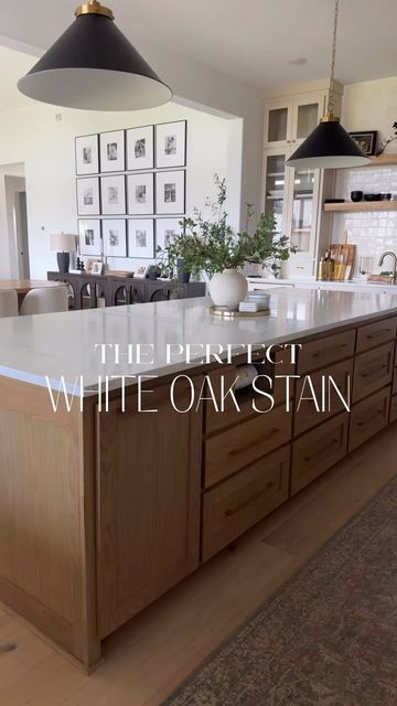 Cindy Nguyen on Instagram: "IYKYK, it is a struggle looking for the perfect white oak stain.   If you’re looking for a neutral medium toned stain for white oak, this @sherwinwilliams custom stain complements the warm and earthy tones so perfectly. I used it on my kitchen island, ceiling beams in my LR/DR, and primary BR.   ✨SAVE this for reference later if you want to come back and look at it later   ✨Comment STAIN to receive the photo of the formula label in your DMs. You must be following me to see my DM come through!   Tip: ALWAYS test out the stain on a smaller piece of white oak in the room you’re going to be using it in with other finishes.   #interiordesign #customstain #whiteoak #affordablefinds #neutralhome #whiteoakcabinets #remodeling #organicmodern" White Oak Built In Cabinet, White Oak Stain Formula, White Oak Island Kitchen, Wood Stained Island, White Oak Stain Colors, White Oak Cabinet Stain Colors, White Oak And White Kitchen, White Oak Cabinets Kitchen, White Oak Kitchen Island