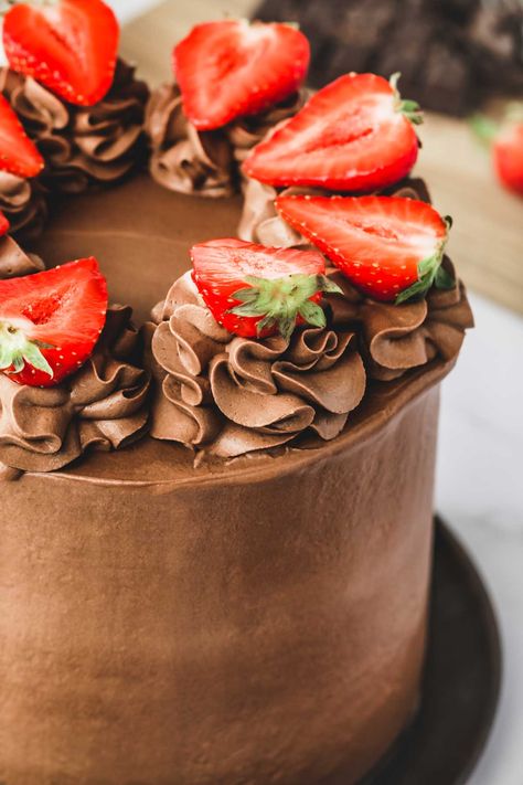 Easy and rich in chocolate this chocolate strawberry cake is loaded with a moist buttermilk chocolate cake, a delicious whipped chocolate ganache frosting, and fresh strawberries. Chocolate Strawberry Cake Recipe, Strawberry Whipped Cream Cake, Buttermilk Chocolate Cake, Strawberry Cake Recipe, Whipped Cream Cakes, Cake Recipes At Home, Whipped Ganache, Strawberry Cream Cakes, Chocolate Ganache Frosting