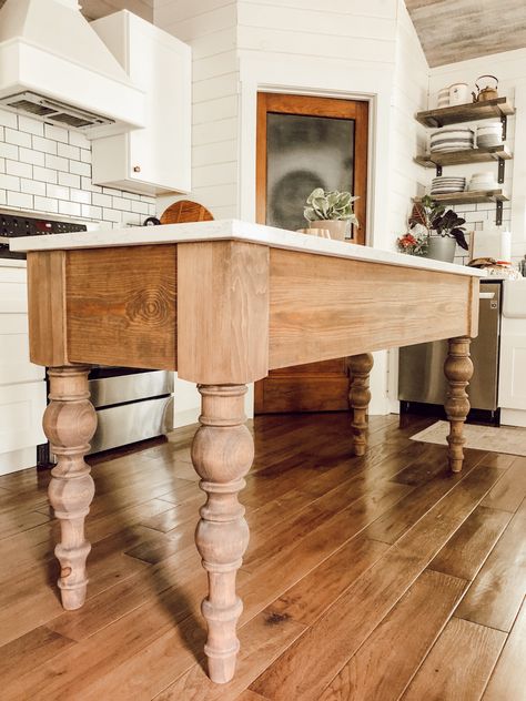 Farmhouse Table With Shelf, Rustic Farm Table Kitchen, Furniture Used As Kitchen Island, Chandelier Over Small Kitchen Island, Marble Top Kitchen Work Table, Farmhouse Table As Kitchen Island, Kitchen Island Table Combo Farmhouse, Antique Kitchen Island Table, Table Legs On Kitchen Island