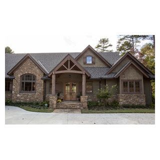 The stone accents, green siding, and stain grade trim create a rustic design on the exterior of this mountain lake house. Mountain Lake House, Green Siding, Log Cabin Floor Plans, Stone Exterior Houses, Mountain Home Exterior, Types Of Bricks, Rustic Exterior, Cabin Floor, Craftsman Exterior