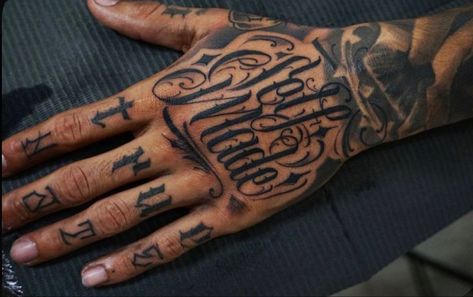 Rappers Hand Tattoos, Backhand Tattoos Men, The World Is Yours Hand Tattoo, Self Made Hand Tattoo, Writing Hand Tattoo, Hand Tattoos Lettering, Hand Tattoo Writing, Lettering Hand Tattoo, Chicano Hand Tattoo