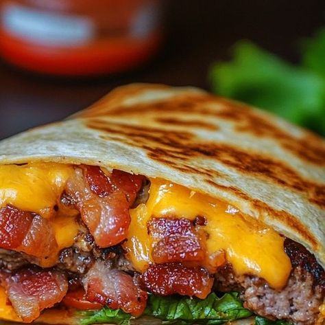 Victoria Hudson on Instagram: "Cheesy Bacon Burger Wraps – A flavor explosion in every bite! These wraps combine all the best parts of a classic burger—juicy beef, crispy bacon, and melty cheese—into a convenient, crispy tortilla wrap. Perfect for a quick dinner or lunch!
Ingredients:
1 lb ground beef 🍖
8 slices of bacon, cooked and crumbled 🥓
1 cup shredded cheddar cheese 🧀
4 large flour tortillas 🌯
1/2 teaspoon garlic powder 🧄
1/2 teaspoon onion powder 🧅
1/2 teaspoon paprika 🌶️
Salt and pepper, to taste
2 tablespoons mayonnaise (optional) 🥄
Lettuce leaves (optional) 🥬
Sliced pickles (optional) 🥒
Directions:
1. Cook the Beef:
In a large skillet over medium heat, cook the ground beef until browned, breaking it apart as it cooks. Drain any excess fat. Season with garlic powder, on Burger Wraps, Sliced Pickles, Classic Burger, Tortilla Wrap, Pickle Slices, Bacon Burger, Cheesy Bacon, Melty Cheese, Tortilla Wraps