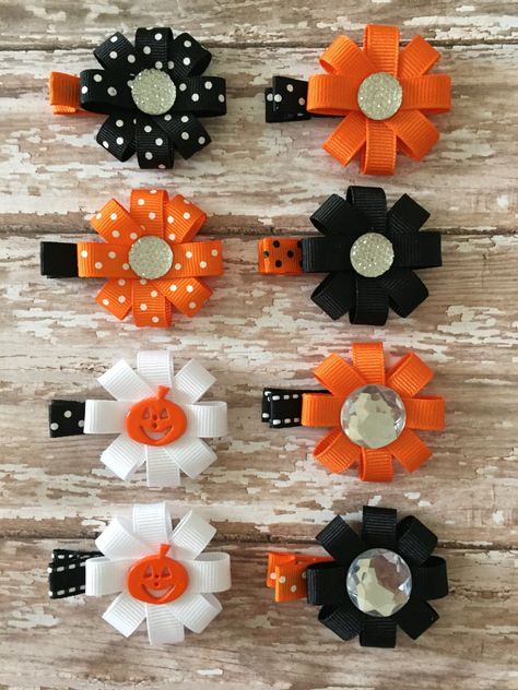 "This listing is for one Halloween hair clip....CHOOSE WHICH COLOR/STYLE YOU WOULD LIKE AT CHECKOUT. The Halloween hair clip hair bow is the perfect size for clipping over a ponytail or as a side clip! Each one measures approximately 2 inches in diameter and secured on a grosgrain ribbon covered alligator clip.  This bow is created with 3/8\"  grosgrain ribbon with a crystal gem or pumpkin embellishment for the center. Colors may vary due to different computer settings.  All ribbons are heat sea Baby Barrettes, Halloween Hair Bow, Halloween Hair Clips, Halloween Hair Bows, Hair Bow Tutorial, Hair Clips Diy, Ribbon Sculpture, Halloween Bows, Baby Hair Accessories