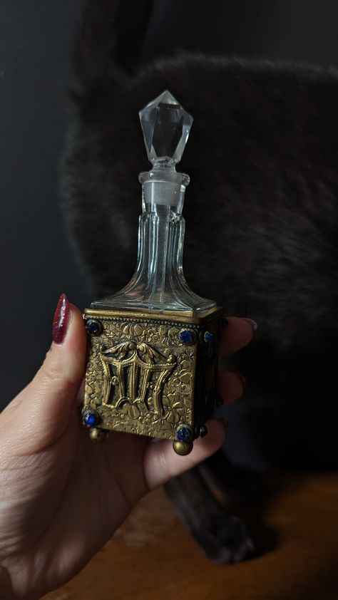 Missing two blue gems on one side Crystal bottle and stopper in perfect condition Caddy measures 1.75" square, bottle measures 4" tall