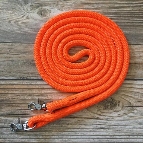 New style of reins available! This is our finesse style rein, made with hard spliced snaps and no leather ends. These reins are $25 for an 8’ set, and are also available in longer lengths and split reins as well.  The reins pictured are available & ready to ship, they are a 10’ blaze orange pair, perfect for trail riding and the upcoming hunting season! They are $29 plus shipping. . . . . . #horsesofinstagram #equine #equestrian #horsetack #rodeo #barrelracing #blmmustang #horsetrainer #horsetra Orange Horse Tack, Horse Lead Rope, Horse Lead, Horse Reining, Horse Halter, Rope Halter, Western Tack, Lead Rope, Horse Equipment