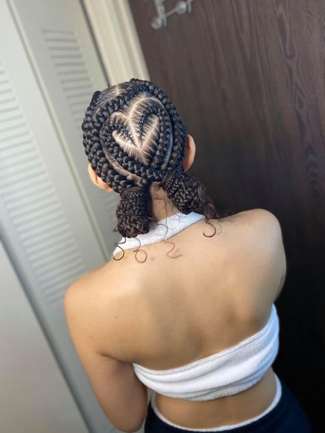 Cornrows With Heart Design, Stitch Braids With Design With Bun Curls, Feed In Braids Ponytail Bun, Straight Back Feed In Braids With Heart, Stitch Braids With Design With Bun, Feed In Braids Cornrows With Designs, Unique Braided Hairstyles For Black Hair, Heart Cornrows, Design Braids