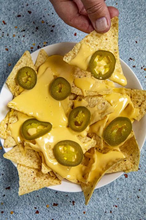 This spicy homemade nacho cheese sauce recipe is easy to make and tastes just like movie theater nachos with a trick I learned behind the concession stand. Easy Pickling Spice Recipe, Pickled Jalapenos Recipe, Nacho Cheese Recipe, Easy Nacho Cheese, Nacho Cheese Sauce Recipe, Homemade Nacho Cheese, Pickled Jalapeno Recipe, Homemade Nacho Cheese Sauce, Nachos Cheese Recipe