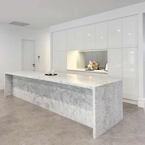 Bianco Carrara Marble Kitchen | Uniq Stone Deluxe Natural Stone The mitred waterfall ends, vein matched front panel on the island, and side panels make it a real standout. This Italian marble adds a touch of class, making it the perfect centrepiece for your home. Want to bring this natural beauty into your kitchen? Visit www.uniqstone.com.au #marble #adelaidemarble #marblekitchen #marblebenchtops #marbledesign #stonemason #benchtopsadelaide #stonebenchtops #adelaidehomes #interiodesign #kit... Carrara Marble Kitchen, Stone Bench, Italian Marble, Kitchen Marble, Carrara Marble, Marble Design, Panel Siding, Marble, Stone