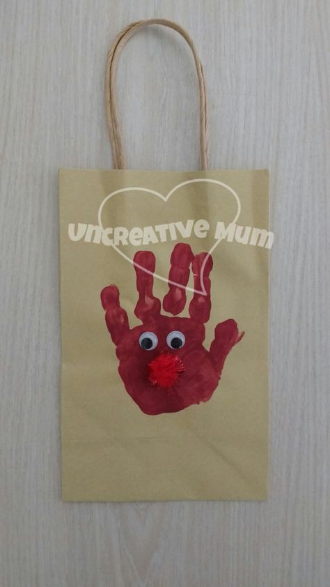 Rudolph handprint gift bag www.uncreativemum.wordpress.com    kids painting, Christmas craft, handprint craft, footprint craft, sensory play, kids craft, toddler craft, easy craft, preschool craft, educational play, Uncreative Mum Christmas Craft Handprint, Footprint Painting, Craft Toddler, Craft Handprint, Craft Preschool, Toddler Craft, Footprint Craft, Handprint Gifts, Educational Play