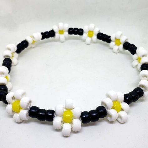 Brighten Up Your Outfit With This Cute Daisy Flower Kandi Choker. This A Stretchy Kandi Choker And Made To Fit Mostly Any Size Neck. This Choker Is Made With Stretchy String To Ensure A Comfortable Fit For Everyone! :) Necklace Is 11 Flowers Around With 33 Single Black Beads. *Note: Please Be Gentle When Putting On And Taking Off Kandi Jewelry, As It Is Delicate* Tags: Edc, Edm, Rave, Festival, Kandi, Plur, Kawaii, Kandi Necklace, Daisy Flower Kandi Choker, Boho Choker, Beaded Choker Kandi Choker, Kawaii Kandi, Festival Kandi, Kandi Jewelry, Cat Necklace Gold, Kandi Necklace, Faceted Glass Bead Necklace, Extra Long Necklace, Edm Rave