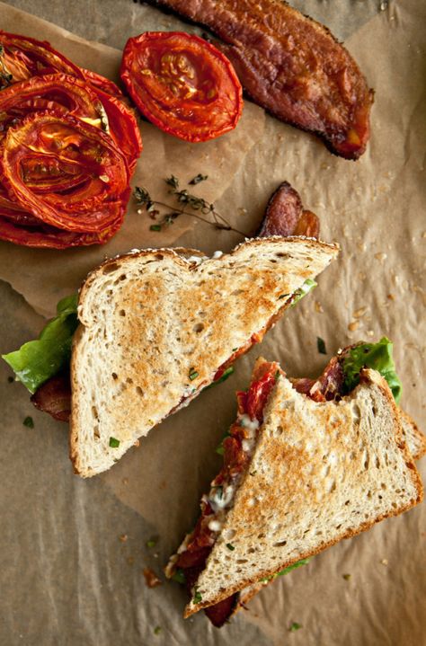 Here are two easy ways to bring life to your BLT: Stir some basil in your mayo and roast your tomatoes. The tomatoes get all sweet and juicy. You should probably make a double batch to eat all week long.  Get the recipe from Not Without Salt »   - Delish.com Slow Roasted Tomatoes, Slow Roast, Roasted Tomato, Soup And Sandwich, Aioli, Roasted Tomatoes, I Love Food, Cooking Tips, Lettuce