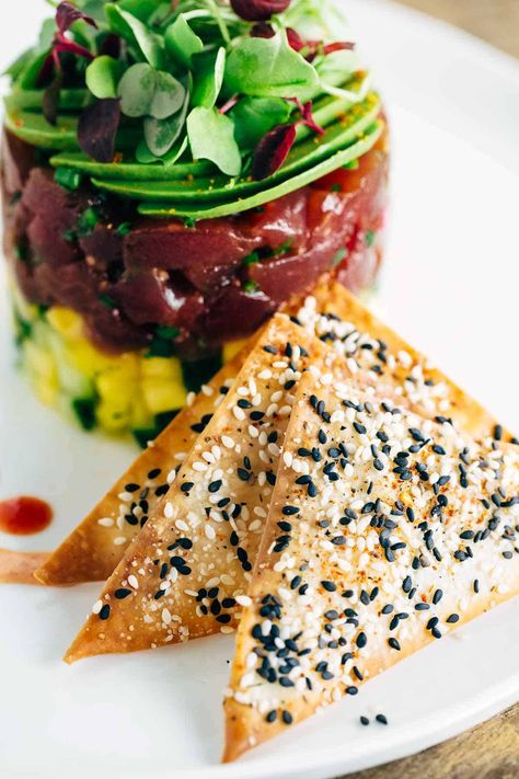 Tuna Tower with Baked Wonton Crisps - Jessica Gavin Ahi Tower Recipe, Spiced Crackers, Poke Stack, Wonton Crisps, Tuna Tower, Eating Less, Ahi Tuna, Food Board, Foods Delivered