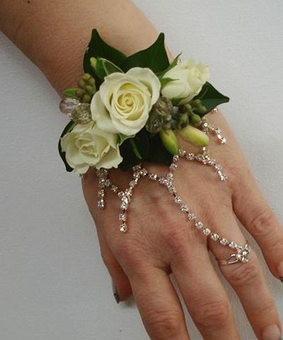 Crystal Corsage... Love the corsage minus the crystals Bridesmaid Corsage Bracelet, Silver Flower Crystal Bracelet For Party, Elegant Flower Crystal Bracelet For Weddings, Silver Flower Crystal Party Bracelet, Crystal Corsage, Corsage Ring, Wrist Corsage Prom, Prom Corsages, Tiara Accessories