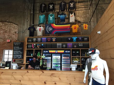 Brewery Retail Display, Retail Shirt Display, Merchandise Wall Display Ideas, Brewery Merchandise Ideas, Brewery Merchandise Display, Merch Display Ideas, Merchandise Display Ideas, Bar Merch, Merch Wall