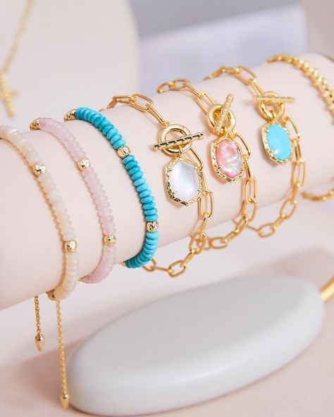 If you’re looking to shake up your bracelet stack, look no further than the Daphne Gold Link and Chain Bracelet in Variegated Turquoise Magnesite. With its paperclip chain, and detailed toggle closure, this bracelet does it all. Pair it with the Daphne Link and Chain Necklace for a chic, coordinated look. Metal 14k Yellow Gold Over Brass Material Variegated Turquoise Magnesite Closure Toggle Size 6.5"Inner CircumferenceDue to the one-of-a-kind nature of the medium, exact colors and patterns may vary slightly from the image shown. | Kendra Scott Daphne Gold Link and Chain Bracelet in Variegated Turquoise Magnesite | Variegated Magnesite Wrist Stack, Gold Bracelets Stacked, Kendra Scott Bracelet, Preppy Bracelets, Preppy Jewelry, Gold Link Chain, Gold Link, Jewelry Lookbook, Gold Band Ring