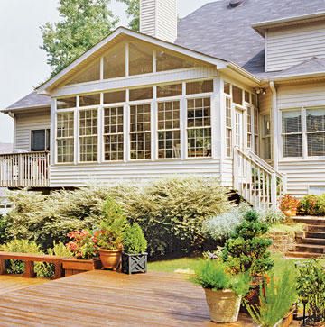 This addition's exterior was styled to match the existing house with easy-care vinyl siding and windows. Lush landscaping hides the exposed foundation and makes the addition look as though it were part of the original structure. Sunrooms Ideas, Sunroom Windows, 3 Season Room, 4 Season Room, Four Seasons Room, Sunroom Addition, Three Season Room, Kitchen Addition, Sunroom Designs