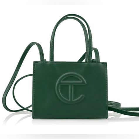 The Iconic Unisex Shopping Bag Is An Everyday Bag For Everyone. Featuring A Double Strap (Handles And Cross-Body Straps), Embossed Logo, And Magnetic Snap Closure. Made From Faux Leather And Twill Lining. Bag Is Packaged In A Drawstring Bag With Screen-Printed Logo. Materials 50% Polyurethane, 50% Polyester Dimensions Height 4 3/4", Width 6 5/8", Depth 3", Strap Drop 21", Handle Drop 4 3/4" Telfar Bags, Ugg Bag, Packing Slip, Medium Tote, Mini Tote, Shopper Bag, Bags Designer Fashion, Everyday Bag, Green Bag