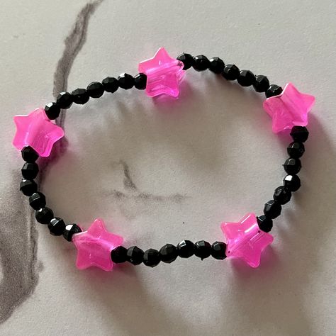 Pink glow star beads with black. Glow stars *lightly* glow in the dark but are not super bright due to dye. Handmade with plastic beads. Bracelet is 7inches around; fits a 6.5in wrist. Rave Kandi, Glow Stars, Star Beads, Resin Bracelet, Black Bracelet, Black Bracelets, Plastic Beads, Beads Bracelet, Pink And Black