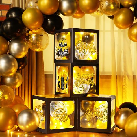 PRICES MAY VARY. Gold and Black Party Decorations Set: you will receive 4 pieces birthday balloon boxes with letters, each measures 11.8 x 11.8 x 11.8 inch, 8 pieces birthday cards with 2 sheets glue point dots, 35 pieces 5 inches balloons and 4 pieces 3.3 feet long warm white string lights, great for gold and black birthday party decorations Classic Design: the gold and black balloon boxes feature black transparent design, with "happy birthday to you" letters, and patterns like gift box, birthd Gold And Black Party Decorations, Gold And Black Party, Gold And Black Birthday, Balloon Boxes, Black Party Decorations, Women Birthday Party, Western Birthday Party, New Year's Party Decorations, Balloon Box