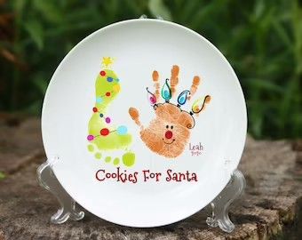 Baby Footprint Christmas Plate, Handprint Cookie Plate, Handprint Ceramic Plate Christmas, Handprint Ceramic Plate, Baby Foot Print Art Christmas, Handprint Santa Cookie Plate, Handprint Cookies For Santa Plate, Cookie Plates For Santa Diy, Baby Santa Cookie Plate