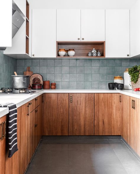 The perfect Indian kitchen.  Compact yet ergonomic. Everything within an arm’s reach - aesthetic yet minimal.  We chose a palette that’s timeless with the classic wood and white combination with the only pop being the blue-grey tile on the backsplash  Absolutely simple 🥰 .  #studioipsa #kitchen #kitchendesign #kitcheninspiration #kitchensofinstagram #interiordesign #interiorstyling #homedecor #interiordesignideas #interiordesigninspiration #interiorinspiration #interiordesignstudio Indian Kitchen Tiles Design, Simple Indian Kitchen Interior, Kitchen Interior Indian, Simple Kitchen Design Indian, Indian Kitchen Interior, Indian Kitchen Design Ideas, Kitchen Design Indian, Indian Kitchen Design, Simple Kitchen Design