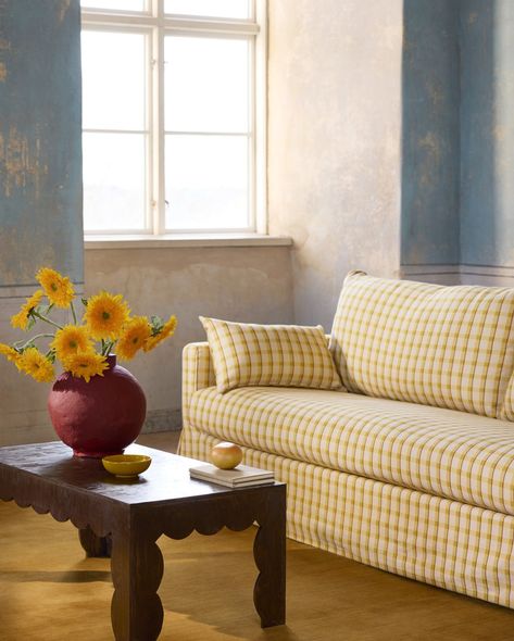 For the SS24 Linen & Lines Collection, we continue to explore prints on our bestselling Simply Linen fabric. This is Picnic Check in Sunflower yellow, its muted yet bold tones will add liveliness to your home. It’s made from 100% natural material, combining the softness of brushed linen with the durability of cotton. 

Bring the sunshine in with playful patterns that speak to you. Pull out stripes. Stir in checks. Flirt with the two and invigorate your home to reflect your true self! Gingham Sofa, Playful Interior, Striped Armchair, Checks And Stripes, Yellow Sofa, Headboard Cover, Daybed Covers, Bean Bag Covers, Linen Fabrics