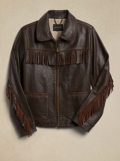 Based on a vintage piece from the Banana Republic archives, this luxurious, burnished leather jacket delivers emotional appeal with textured, fringed trim at the shoulders and sleeves, plus patch pockets for a true rancher-style silhouette.  WARMER: Luxury Vintage Leather Jacket With Pockets, Understated Leather Brand, Collared Leather Jacket, Cool Leather Jackets, Fringe Clothes, Cowboy Leather Jacket, Brown Fringe Jacket, 60s Jacket, Fringe Jacket Outfit