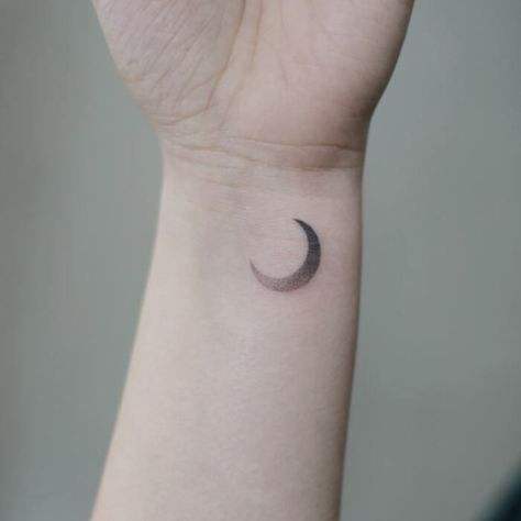 Love simple lines? These minimalist tattoo ideas include everything from airplanes and dinosaurs to aliens to inspire your next one. #tattoos #tattooideas #minimalism Elegant Moon Tattoo, Minimal Moon Tattoo, Minimalist Nature Tattoos, Tattoos Masculinas, Luna Tattoo, Rainbow Tattoos, Moon Tattoos, Ring Finger Tattoos, Palm Tattoos