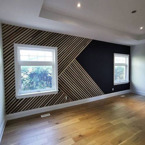 Now this is an accent wall! Over 25 ft long and painted in Onyx Black. We used our "classic" geometric design with slight twist to… Accent Wall Ideas Living Room, Trim Accent Wall Ideas, Wood Trim Accent Wall, Accent Wall Hallway, Trim Accent Wall, Wood Trim Walls, Vertical Slats Wall, Slat Accent Wall, Accent Wall Design