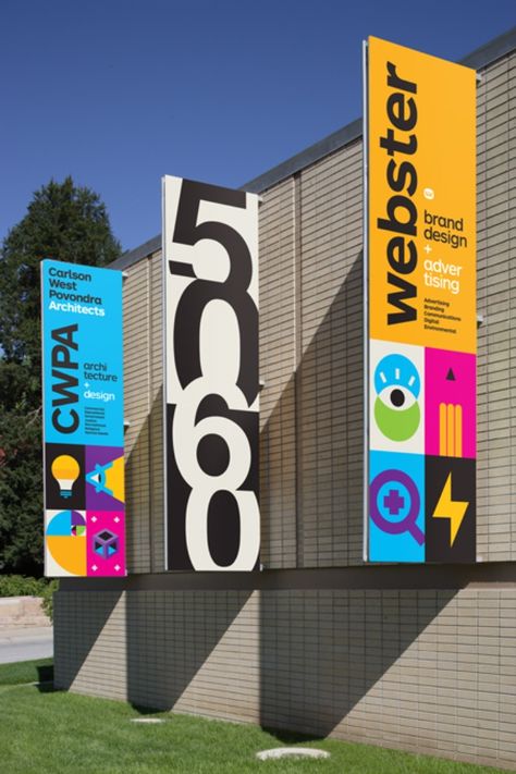 Webster/CWPA Building Banners - Graphis Ceiling Banner Design, Flag Banner Design, Branding Design Corporate, Signage Design Outdoor, Vertical Banner Design, Building Banner, Banner Graphic Design, Welcome Sign Design, Pull Up Banner Design