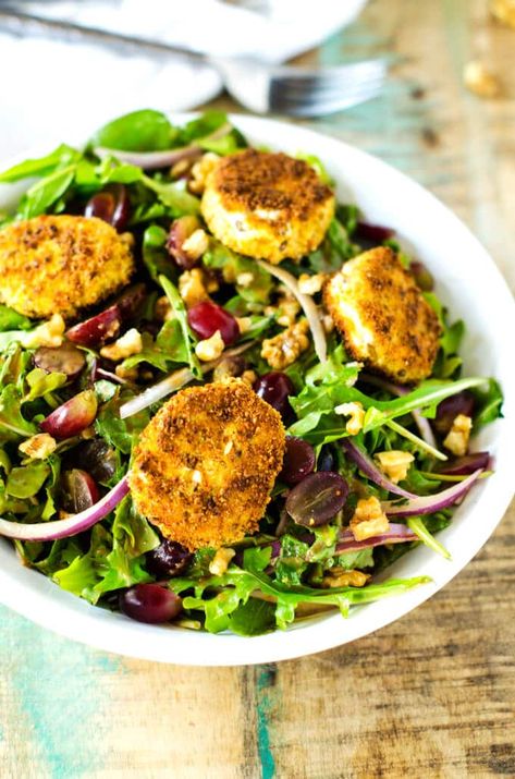 This Fried Goat Cheese Salad has a delicious Balsamic Vinaigrette Dressing and is Gluten Free. The goat cheese is coated in gluten free breadcrumbs and browned to crispy perfection. Fried Goat Cheese Salad, Salad With Grapes, Fried Goat Cheese, Balsamic Vinaigrette Dressing, Red Onion Salad, Winter Salad, Eat Salad, Strawberry Salad, Goat Cheese Salad