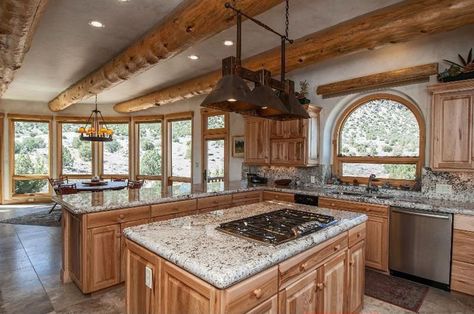 Rustic kitchen with andino white granite countertops, wood cabinets and porcelain tile floors Rustic Tile Floor, Kitchen Wood Cabinets, Rustic Countertops, White Granite Countertops, Outdoor Kitchen Countertops, Rustic Tile, Rustic Kitchen Cabinets, Outdoor Kitchen Appliances, Kitchen Rustic