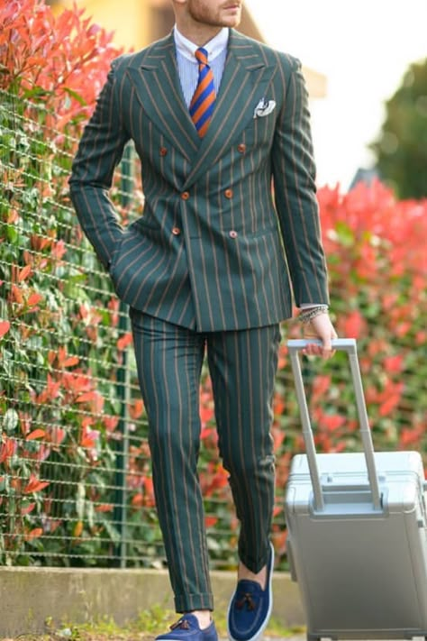 This pinstripe green double breasted suit is a daring turn on a mens fashion classic. Colorful wedding suits like this is the perfect option for groom style these days. If you would like a suit like this custom made for you, book an appointment online with us at Giorgenti New York! Stripped Suits Men, Modern Pinstripe Suit Men, Double Breasted Suit Men Classy, Mens Suits Style Modern Fashion Looks, Pinstripe Suit Outfit, Green Double Breasted Suit Men, Pinstripe Double Breasted Fitted Suit, Green Pinstripe Suit, Pinstripe Suits Men