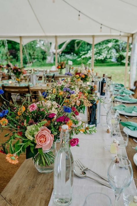 A flower-filled wedding day with bursts of colour at Uphill Farm, as featured in Wed Magazine. #wedmagazine #wedmagazinecornwall #wedmagazinedevon #bride #wedding #weddingplanning #weddinginspiration #weddinginspo #devon #devonbrides #devonbride #devonwedding #devonweddings #weddingdevon #2023bride #2024bride #colourfulwedding #farmwedding #ruralwedding Summer Farm Wedding Colors, English Farm Wedding, Rural Wedding Ideas, British Countryside Wedding, Uk Farm Wedding, Fall Wedding Next Feild, Farm Wedding Marquee, Hardy Farm Wedding, Gedney Farm Wedding