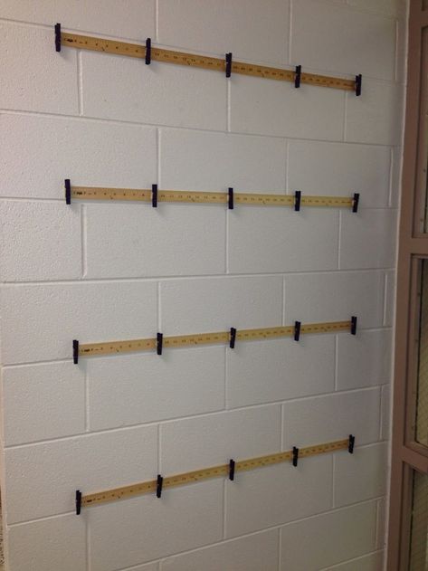 I tried to figure out a new, different way to hang my students work this year. I used clothespins last year, but when the hallway got re... Classroom Artwork Display, Preschool Art Display Ideas Classroom, Wall Painting Ideas For Kids, Art Display Ideas Classroom, Classroom Artwork, Painting Ideas For Kids, Wall Painting Ideas, Hallway Art, Class Organization