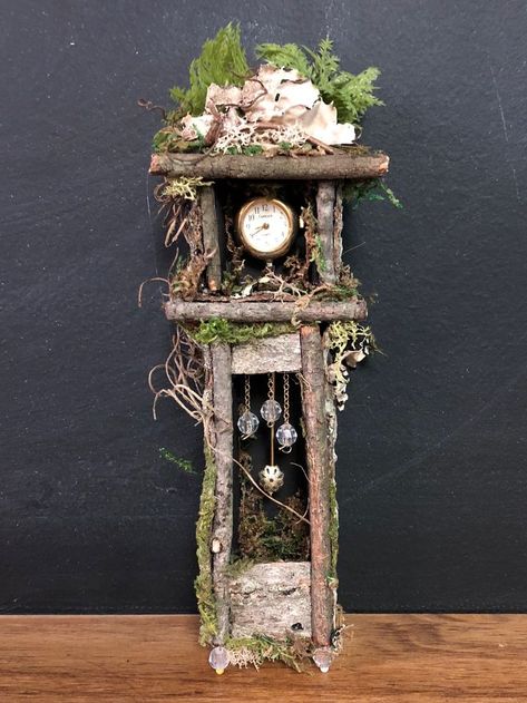 Grandfather clock with repurposed bits of jewelry and watch. | Fairy house diy, Fairy garden crafts, Miniature fairy gardens Making Miniature Houses, Diy Fairy Garden, Twig Furniture, Fairy Tree Houses, Fairy House Crafts, Fairy Garden Furniture, Fairy Homes, Fairy House Diy, Fairy Garden Crafts