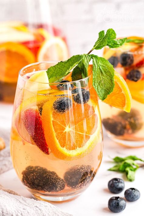 This White Sangria is a huge hit any time we make it for a BBQ, holiday gathering or social event. Kick back and enjoy a glass of white sangria this summer! White Sangria Recipe Fall, Thanksgiving Sangria Recipes White Wines, Thanksgiving Sangria Recipes, Sangria Recipes White, Riesling Sangria, Moscato Sangria Recipes, Thanksgiving Sangria, Pineapple Sangria, Best Sangria Recipe