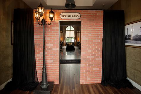 Custom made speakeasy secret entrance door for a Prohibition party theme with Roaring 20's Art Deco graphics and decor  by Unlimited Events  #gatsbyparty #greatgatsby #roaring20s #speakeasy #themeparty #speakeasydoor #customeventdecor #prohibition #prohibitionparty #roaring20stheme Prohibition Party Decorations Diy, Prohibition Halloween Party, Speakeasy Door Entrance Diy, Bootleggers 1920s Speakeasy Party, Roaring 20s Halloween Party, Roaring 20s Party Entrance, Speakeasy Photo Booth, Speakeasy Bar Entrance, Speakeasy Aesthetic Party