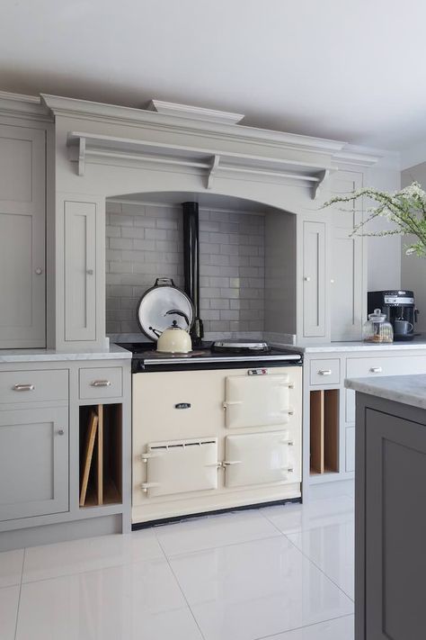 Charlie Kingham bespoke kitchen with cream AGA range cooker Cream Cooker Kitchen, Kitchen With Everhot Range, Kitchen Mantle Over Aga, Cream Aga Kitchen, Kitchen With Aga Stove, Kitchens With Aga Cookers, Cream Range Cooker Kitchen, Aga Surround Mantles, Cream Aga Kitchen Ideas