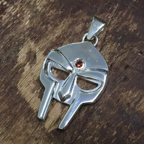 Shane Costello on Instagram: “Finished a MF DOOM mask pendant made from Sterling silver set with a red garnet stone. This was one of my favourite pieces I've made. It…” Doom Mask, Mf Doom Mask, Mf Doom, Garnet Stone, Red Garnet, Made It, My Favourite, Garnet, Mask