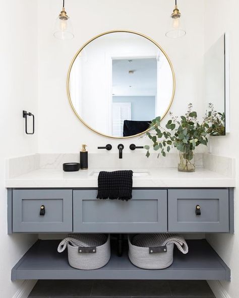 Streamline Construction on Instagram: "This stunning floating vanity is equipped with an additional bottom shelf for storage, allowing this bathroom to be both stylish and functional. The leather pulls and gray paint provide a masculine yet soft feel.🖤✨ 📸: @leighannrowe Design: @madisonbettis" Half Bathroom Ideas Floating Vanity, Floating Vanity For Small Bathroom, Floating Vanity Powder Room, Floating Sink Bathroom, Under Vanity Storage, Floating Sink Vanity, Floating Vanity Bathroom, Scandi Farmhouse, Victorian Style Bathroom