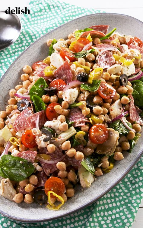 This Antipasto Chickpea Salad will fill you up ALL day.  Get the recipe at Delish.com. #recipe #easy #easyrecipes #delish #antipasto #chickpea #salad #tomato #salami #artichoke #mozzarella #cheese #italian #olives Chickpea Antipasto Salad, Salami Chickpea Salad, Antipasto Bean Salad, Cheakpeas Salad Recipes, Wild Rose Detox Recipes, Salad Tomato, Italian Sub, Antipasto Salad, Chickpea Salad Recipes