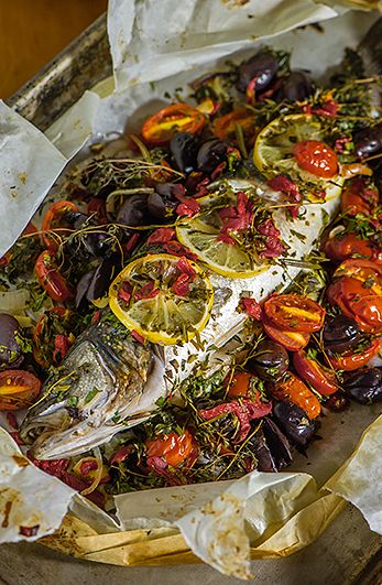 Bronzino with Tomatoes & Herbs en Papillote | Monahan's Seafood Market | Fresh Whole Fish, Fillets, Shellfish, Recipes, Catering & Lunch Counter-Ann Arbor, Michigan Bronzino Fish Recipe, Branzino Recipe, Whole Fish Recipes, Mackerel Recipes, Lunch Catering, Plats Healthy, Whole Fish, Fish Fillets, Seafood Market